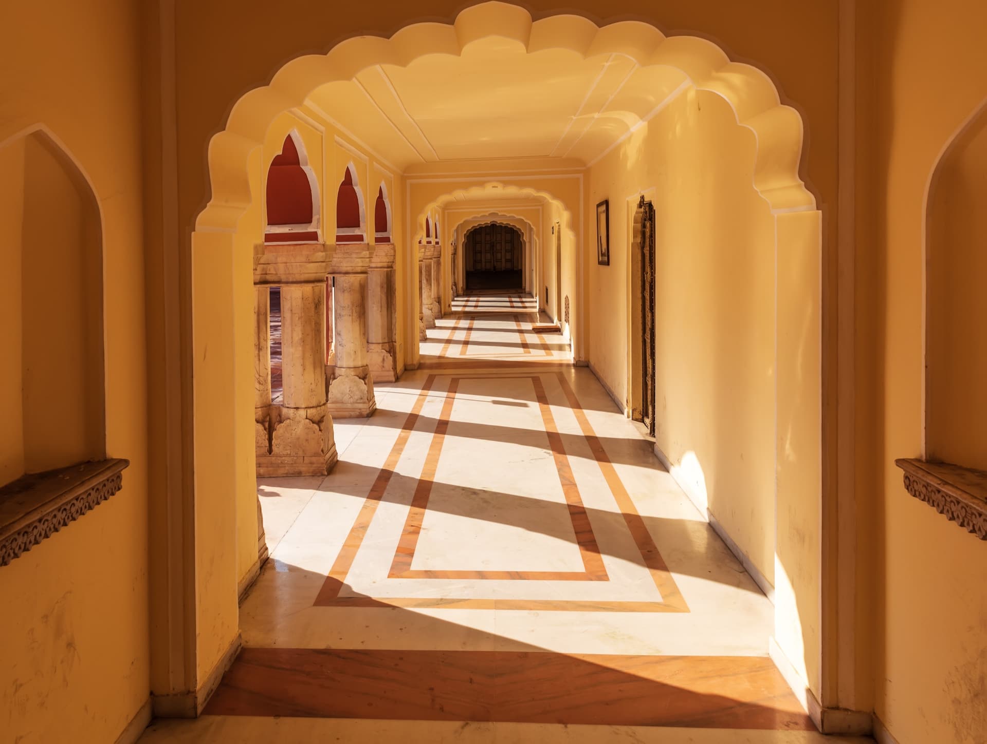 A golden arched hallway in Jaipur